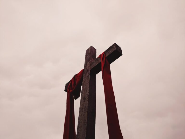 crucificacao de jesus - low angle view of cross with red garment