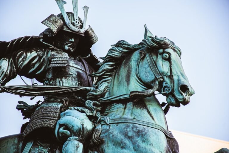samurais do japao - man riding horse statue during daytime