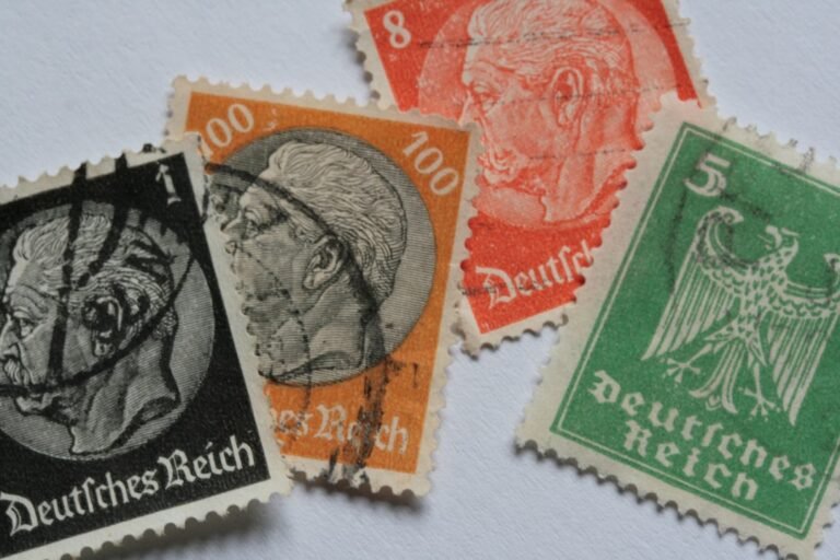 tribos germanicas - a group of three different colored stamps on a white surface