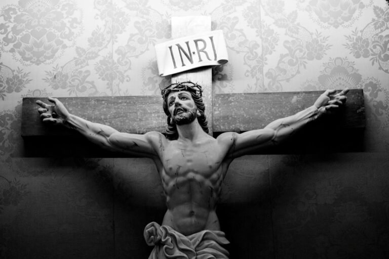 milagres de jesus - grayscale photo of topless man with white and black UNK print
